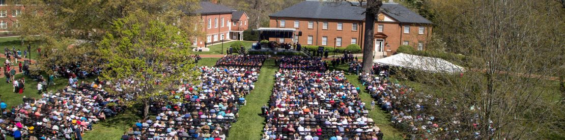 Graduates and families at graduation ceremony