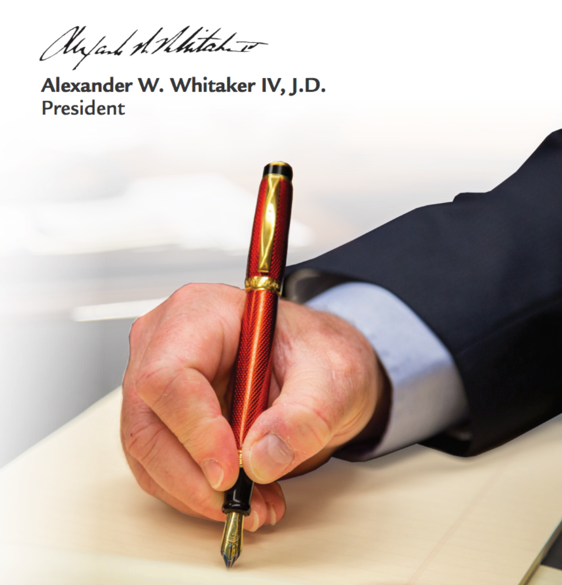 President Whitaker signing signature