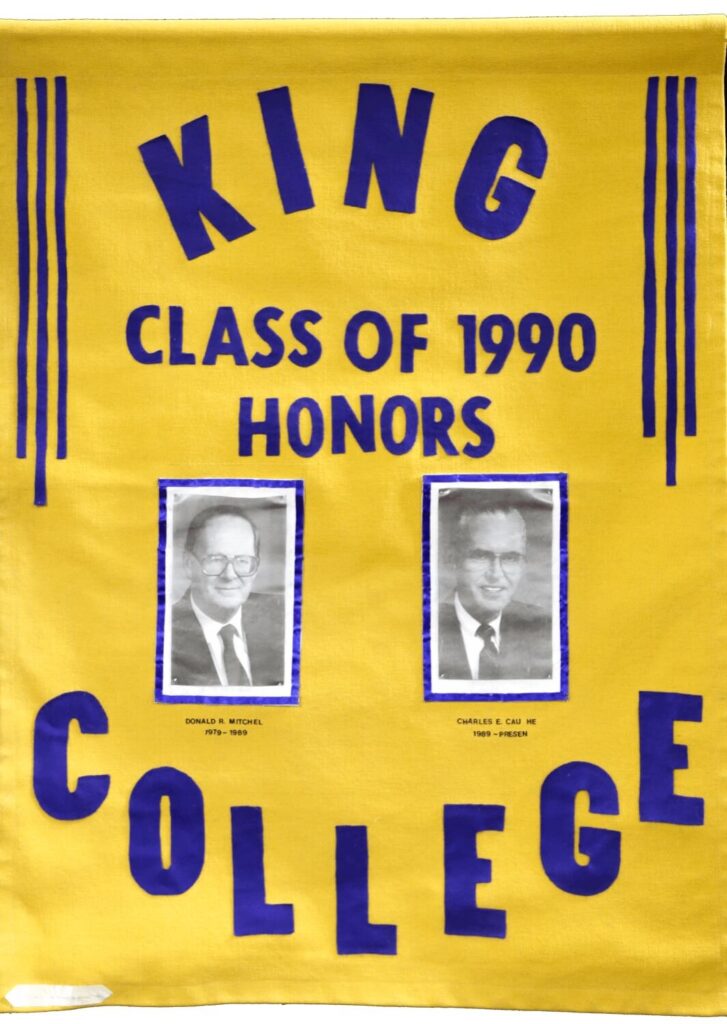 A yellow banner reads King College Class of 1990 Honors in blue letters, with two black-and-white portraits of men underneath. The names Donald B. Windsor and Charles C. Can Hil appear below their respective photos.