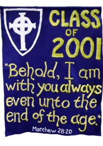 A blue banner with a white cross emblem, yellow text CLASS OF 2001, and a quote: Behold, I am with you always even unto the end of the age. Matthew 28:20.