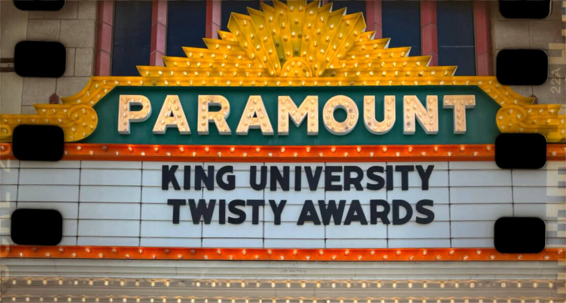 Marquee sign on the Paramount theater displays “KING UNIVERSITY TWISTY AWARDS” in bold letters, with decorative lights and film strip borders.